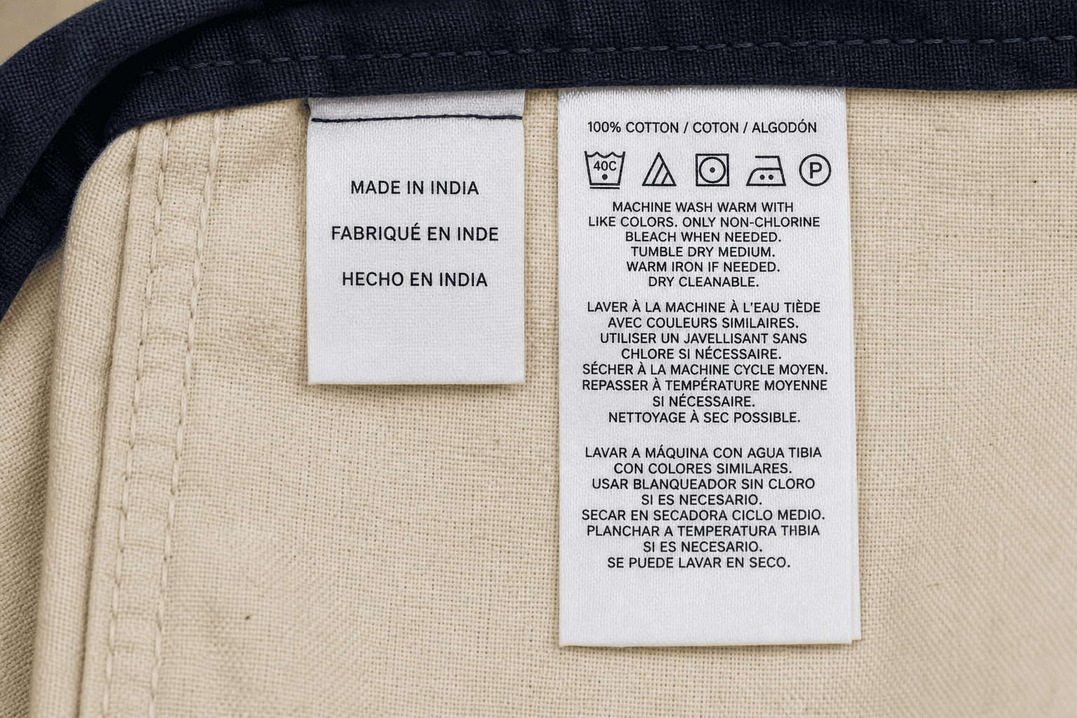 Sewn-in origin and care labels inside an apron