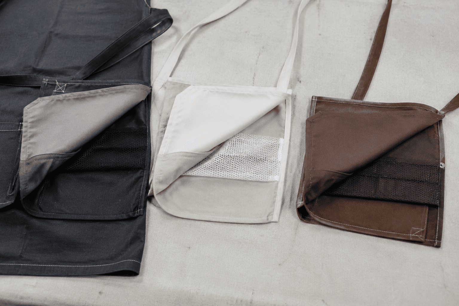 apron pocket construction samples turned open to show self-fabric, lining and mesh pocket bags
