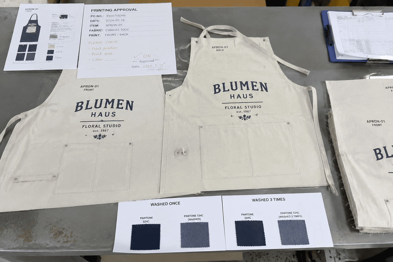 printed apron strike-off panels with approval notes and washed comparison swatches