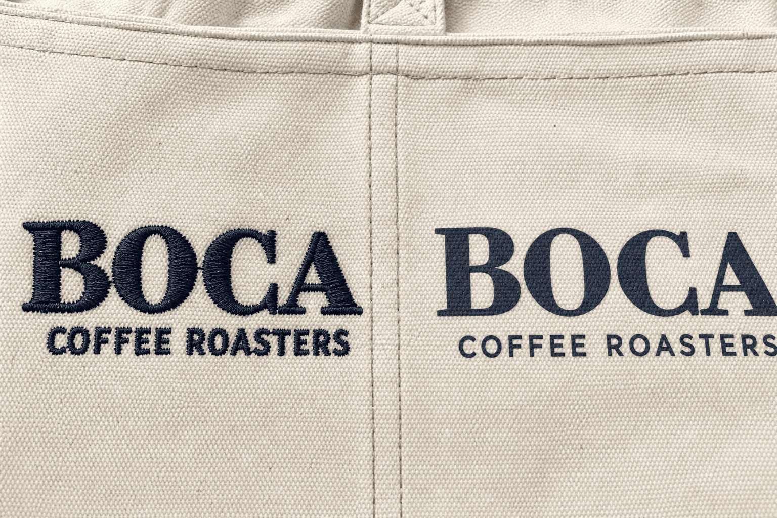 Close-up of an embroidered logo and a screen-printed logo on canvas apron fabric