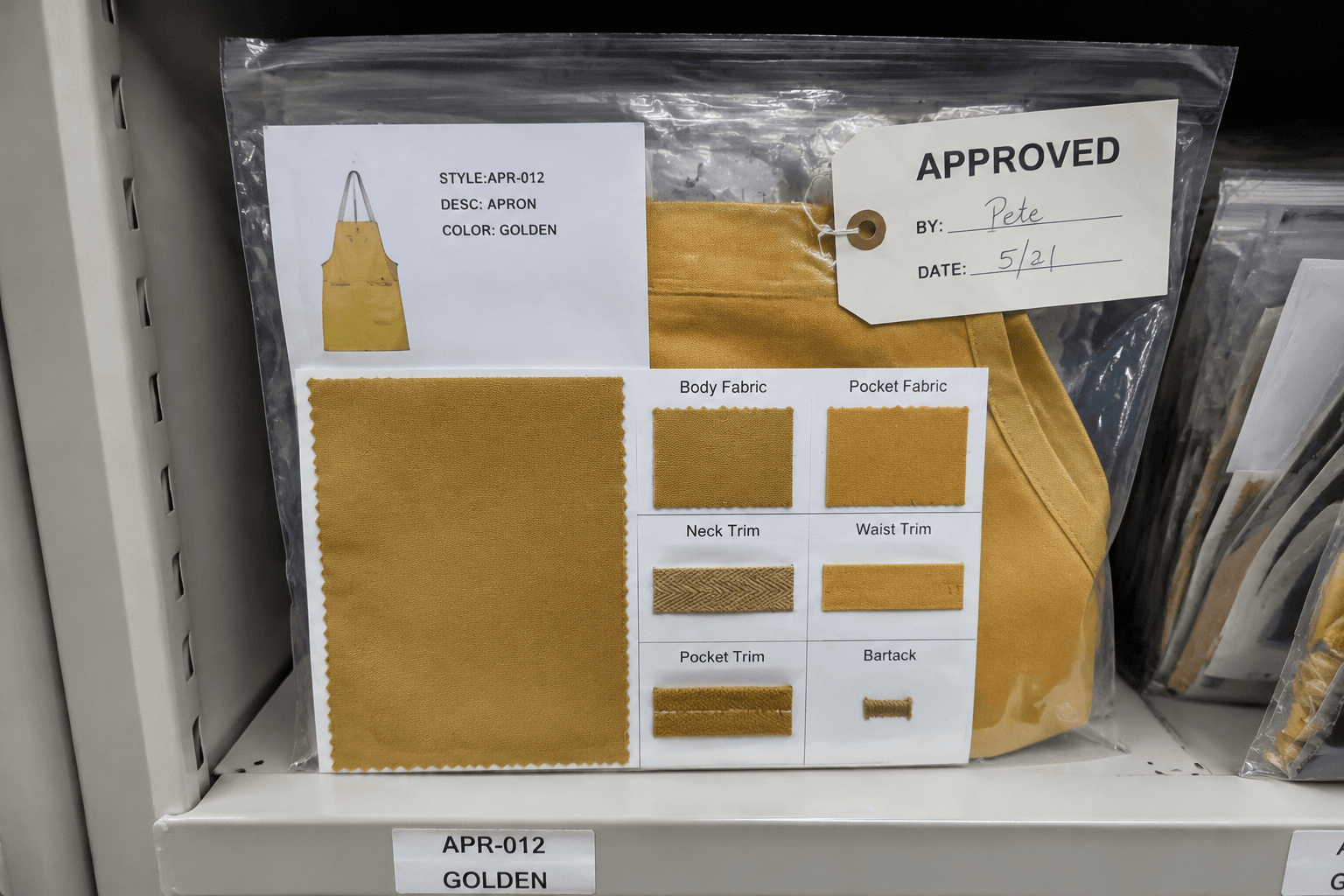 sealed apron golden sample bag with fabric swatch card and trim references