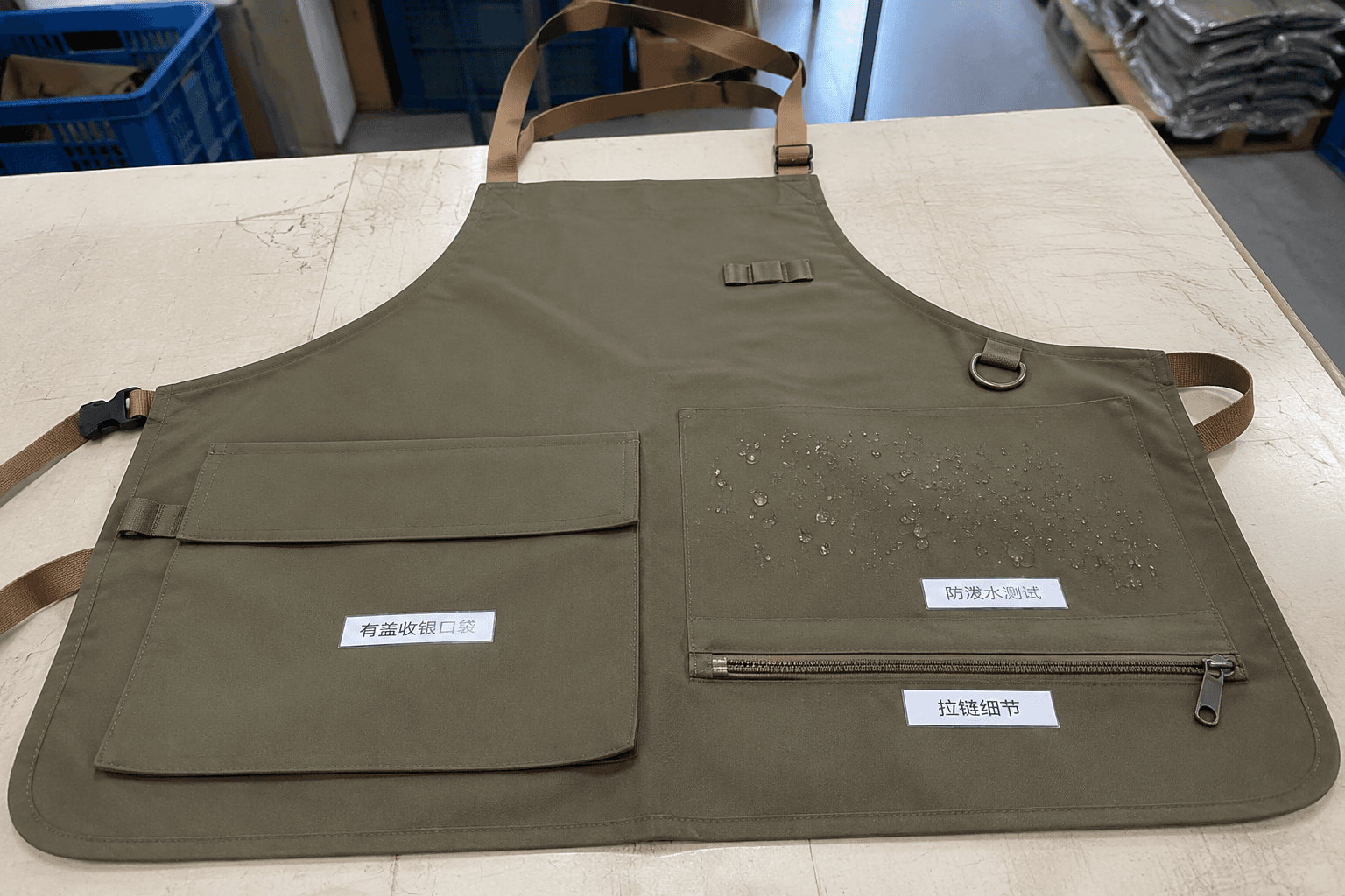 outdoor vendor apron sample with covered cash pocket and water-shedding fabric test panel